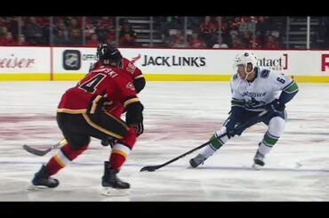 Boeser weaves through Flames beats Gillies with wrist shot