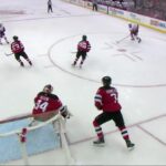 Bo Horvat scores a goal against the New Jersey Devils