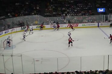 Laval Rocket's Jakub Dobeš stops Utica Comets' Brian Halonen 10/30/24