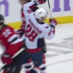 Andrew Mangiapane scores a goal against the New Jersey Devils