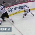 Jack Hughes scores a goal against the Chicago Blackhawks