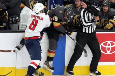 Ovechkin dumps Schmidt into the bench with big hit