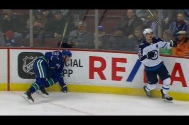 Edler leaves after awkward hit into boards