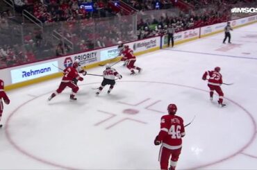 Nico Hischier scores a goal against the Detroit Red Wings