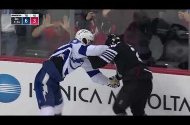 Mikhail Sergachev drop the gloves with Damon Severson, after Studenic crashes into Vasilevskiy