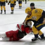 Mark Borowiecki takes down and drags Givani Smith