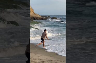 Pro Skimboarder Takes Selfie with Tourist After Riding a Wave