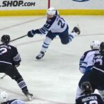 Josh Morrissey scores a powerplay goal against the New Jersey Devils