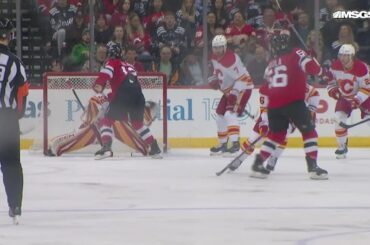 Erik Haula scores a goal against the Calgary Flames