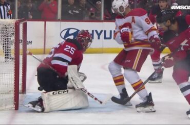 Connor Zary scores a goal against the New Jersey Devils
