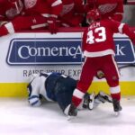 Jets' Byfuglien and Red Wings' Helm exchange big hits moments apart