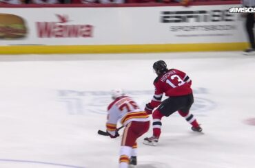 Paul Cotter scores a goal against the Calgary Flames