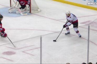 David Perron scores a goal against the New Jersey Devils