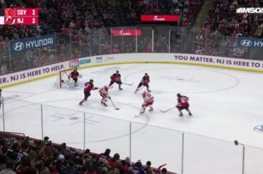 Jonathan Huberdeau scores a goal against the New Jersey Devils