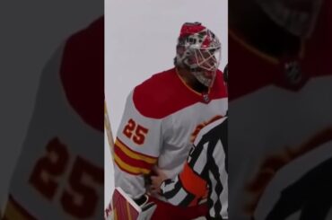 Jacob Markstrom and Casey Cizikas Collide Behind the Net