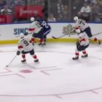 Tkachuk clean check on Holmberg