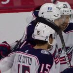 Kevin Stenlund hammers the puck out of mid air into the net