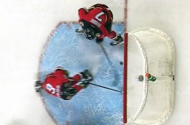 Brodie bats puck headed for the net out of mid-air