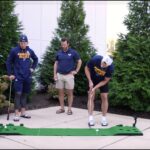 Jake Neighbours and Dylan Holloway play Golf Pong