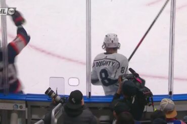 Drew Doughty laughs at Leon Draisaitl after missing the check and hitting the boards.
