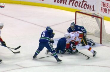 Tanev leaves game after taking hit from deflecting puck