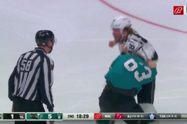 Brendan Lemieux and Jeffrey Viel exchange punches.