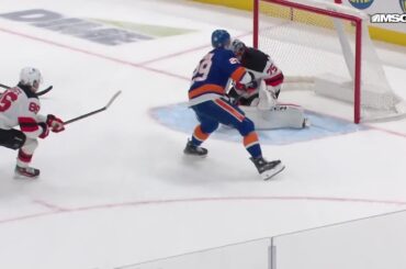 Brock Nelson scores a goal against the New Jersey Devils