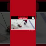 Ryan Leonard sends Yegor Zamula backwards into the neutral zone.