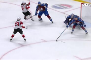 Jack Hughes scores a goal against the Colorado Avalanche