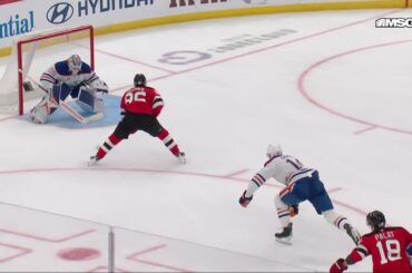 Jack Hughes scores a goal against the Edmonton Oilers