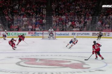 Mathew Barzal scores a goal against the New Jersey Devils