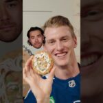 Tyler Myers and Marcus Pettersson Guess Tim Hortons Holiday Smile Cookies