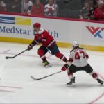 Connor McMichael scores a goal against the New Jersey Devils