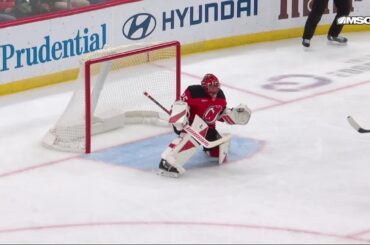 Bo Horvat scores a goal against the New Jersey Devils