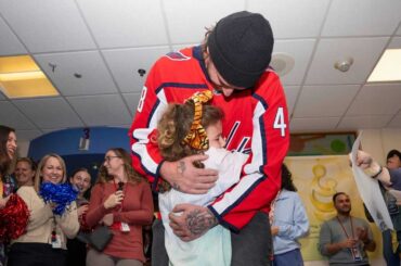 Logan Thompson surprises Sutton, a 7-year-old cancer patient, at bell-ringing ceremony