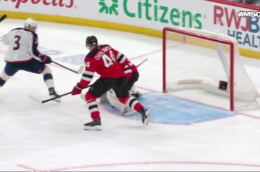Charlie Coyle scores a goal against the New Jersey Devils