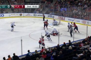 Joe Thornton gives Vincent Trocheck a back massage after a face-off