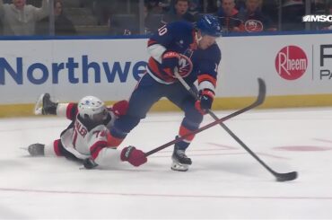 Simon Holmstrom scores a goal against the New Jersey Devils