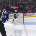 Matthew Knies scores a goal against the New Jersey Devils