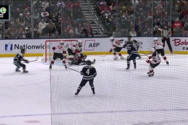 Charlie Coyle scores a goal against the New Jersey Devils
