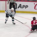 Lawson Crouse scores a goal against the New Jersey Devils