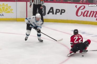 Lawson Crouse scores a goal against the New Jersey Devils