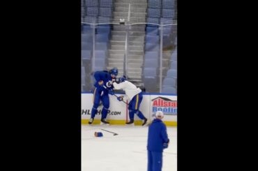 Peyton Krebs and Owen Power face off at the end of Sabres practice