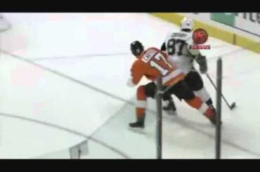 Jeff Carter squashes Crosby against the boards