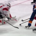 Simon Holmstrom scores a goal against the New Jersey Devils