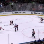 Casey Cizikas scores a goal against the New Jersey Devils