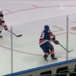 Casey Cizikas scores a goal against the New Jersey Devils