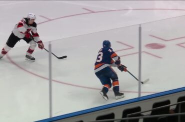Casey Cizikas scores a goal against the New Jersey Devils