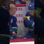 Kuzmenko enjoys a pop and banana on the bench