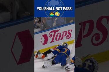 Stopping pucks AND players! 🤣